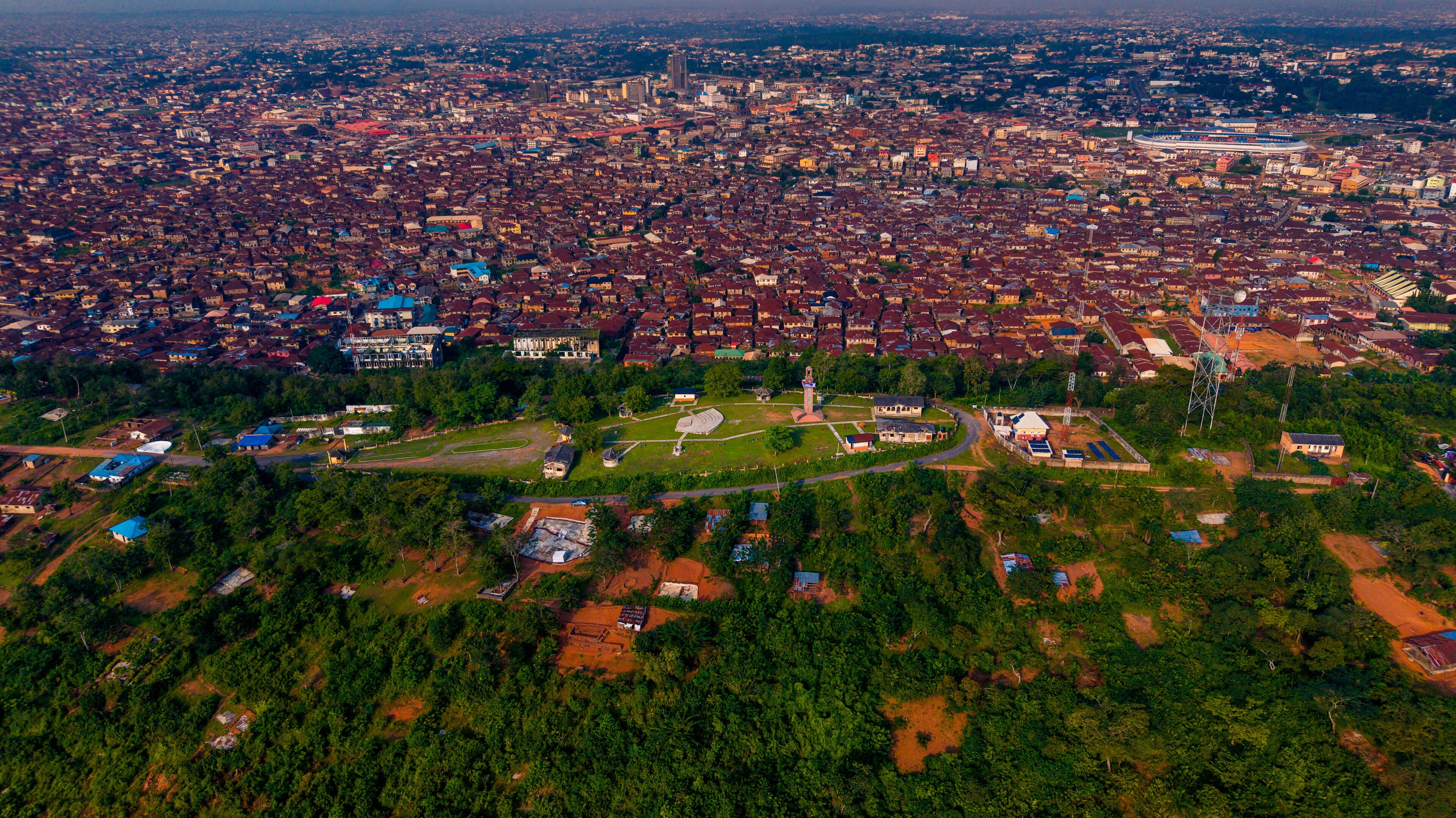 Aerial view across the historic city and red-oxide roofs of Ibadan
